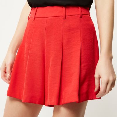 Red pleated shorts